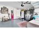 Garage with storage, projector, and a relaxing sleeping area at 2935 Rapollo Ln, Apopka, FL 32712
