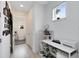 Bright home office with white desk, printer and built-in shelving at 2935 Rapollo Ln, Apopka, FL 32712