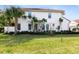 Two-story house with manicured lawn and tropical landscaping at 2935 Rapollo Ln, Apopka, FL 32712