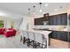 Modern kitchen with dark cabinetry, white countertops, and an island at 2935 Rapollo Ln, Apopka, FL 32712