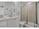 Elegant bathroom with a walk-in shower and double vanity at 3065 Caribbean Soul Dr, Kissimmee, FL 34747