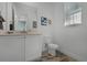 Simple bathroom with toilet, sink, and vanity with storage at 3065 Caribbean Soul Dr, Kissimmee, FL 34747