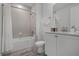 Clean bathroom with a tub, shower, and white vanity at 3065 Caribbean Soul Dr, Kissimmee, FL 34747