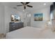Main bedroom with king bed, dresser, and ensuite bathroom at 3065 Caribbean Soul Dr, Kissimmee, FL 34747