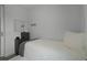 Bright bedroom with twin bed, dresser, and wall mounted mirror at 3065 Caribbean Soul Dr, Kissimmee, FL 34747