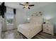 Bedroom with queen bed, wood nightstands, and coastal decor at 3065 Caribbean Soul Dr, Kissimmee, FL 34747