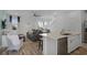 Open concept kitchen with island, stainless steel appliances, and living room view at 3065 Caribbean Soul Dr, Kissimmee, FL 34747