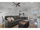 Open living room with a view into the kitchen and dining area at 3065 Caribbean Soul Dr, Kissimmee, FL 34747