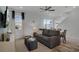 Bright living room features a comfy sofa and access to a patio at 3065 Caribbean Soul Dr, Kissimmee, FL 34747