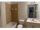 Clean bathroom with a tub, toilet, vanity and mirror at 3133 Sun Lake Ct # B, Kissimmee, FL 34747