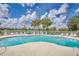 Large community pool with plenty of lounge chairs at 3133 Sun Lake Ct # B, Kissimmee, FL 34747