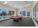 Community game room with pool table and large windows at 3133 Sun Lake Ct # B, Kissimmee, FL 34747