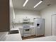 Modern kitchen with white cabinets and a breakfast bar at 3133 Sun Lake Ct # B, Kissimmee, FL 34747
