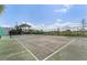 Community tennis court with green surface and white lines at 3133 Sun Lake Ct # B, Kissimmee, FL 34747
