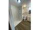 Bathroom features a stand up shower, white cabinetry and neutral paint color, waiting for new owners at 342 E Tillman Ave, Lake Wales, FL 33853