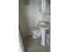 Bathroom featuring a pedestal sink and toilet at 342 E Tillman Ave, Lake Wales, FL 33853