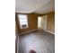 Bedroom with neutral walls, window AC unit, laminate flooring and a closet at 342 E Tillman Ave, Lake Wales, FL 33853