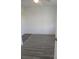 Cozy bedroom featuring fresh paint and wood-look flooring at 342 E Tillman Ave, Lake Wales, FL 33853