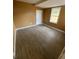 Bedroom features laminate flooring, neutral walls, one window and a closet at 342 E Tillman Ave, Lake Wales, FL 33853