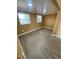 Bedroom features laminate flooring, neutral walls, two windows that allow ample natural light at 342 E Tillman Ave, Lake Wales, FL 33853