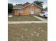 Cute orange house with a yard, and driveway at 342 E Tillman Ave, Lake Wales, FL 33853