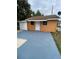 Charming home with a fresh coat of paint, a newly painted driveway, and a well-maintained exterior at 342 E Tillman Ave, Lake Wales, FL 33853