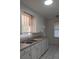 Functional kitchen featuring a window over the sink and tile flooring at 342 E Tillman Ave, Lake Wales, FL 33853