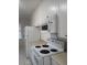 Kitchen featuring appliances, cabinets, and tile flooring at 342 E Tillman Ave, Lake Wales, FL 33853