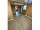 The bright living room showcases vinyl floors, neutral walls and is ready for a new home owner's touches at 342 E Tillman Ave, Lake Wales, FL 33853