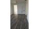Inviting living room featuring built-in shelving and wood-look flooring at 342 E Tillman Ave, Lake Wales, FL 33853