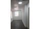 Bright room featuring fresh paint, wood-look floors, and natural light at 342 E Tillman Ave, Lake Wales, FL 33853