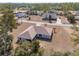 Aerial view of a home with a large yard, enclosed patio, and a serene, wooded neighborhood at 4181 Sw 111Th Pl, Ocala, FL 34476