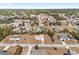 Aerial view of a residential neighborhood with single-Gathering homes and mature trees in a quiet neighborhood at 4181 Sw 111Th Pl, Ocala, FL 34476