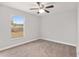 Spacious bedroom with neutral walls, new carpet, and a large window at 4181 Sw 111Th Pl, Ocala, FL 34476