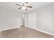 Spacious bedroom with ceiling fan and double doors to closet at 4181 Sw 111Th Pl, Ocala, FL 34476