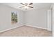 Bedroom with carpet flooring, natural light from a window, and a ceiling fan at 4181 Sw 111Th Pl, Ocala, FL 34476