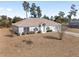 Charming single-story home with landscaped front yard and attached two-car garage at 4181 Sw 111Th Pl, Ocala, FL 34476