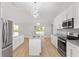 Modern kitchen with stainless steel appliances, granite countertops, and a kitchen island at 4181 Sw 111Th Pl, Ocala, FL 34476