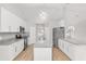 Spacious kitchen with white cabinets, granite countertops, and an island at 4181 Sw 111Th Pl, Ocala, FL 34476
