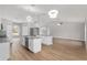 Modern kitchen featuring white cabinets, granite countertops, and stainless steel appliances at 4181 Sw 111Th Pl, Ocala, FL 34476