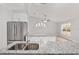 Kitchen with granite countertops, stainless steel sink, and breakfast bar at 4181 Sw 111Th Pl, Ocala, FL 34476