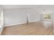 Spacious living room with vaulted ceiling and wood-look floors at 4181 Sw 111Th Pl, Ocala, FL 34476