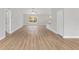 Bright, open-concept living area with wood flooring and plenty of natural light at 4181 Sw 111Th Pl, Ocala, FL 34476