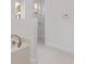 Bright bathroom with a soaking tub and white tile, showing neutral, clean decor at 4181 Sw 111Th Pl, Ocala, FL 34476