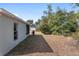 Side yard with green trees and foliage offering privacy and shade from the sun at 4181 Sw 111Th Pl, Ocala, FL 34476
