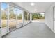Spacious screened-in lanai with walls of windows, offering a bright and airy space for relaxation at 4181 Sw 111Th Pl, Ocala, FL 34476