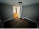 Cozy bedroom featuring modern flooring, neutral paint, and great natural light at 433 Pennsylvania Ave, St Cloud, FL 34769