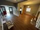 Open living room features modern flooring, neutral paint, and access to other rooms at 433 Pennsylvania Ave, St Cloud, FL 34769