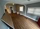 Spacious living room features modern flooring, neutral paint, and lots of natural light at 433 Pennsylvania Ave, St Cloud, FL 34769