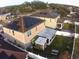 House with solar panels on roof, backyard view at 4702 Greycliff Prairie Dr, Kissimmee, FL 34758